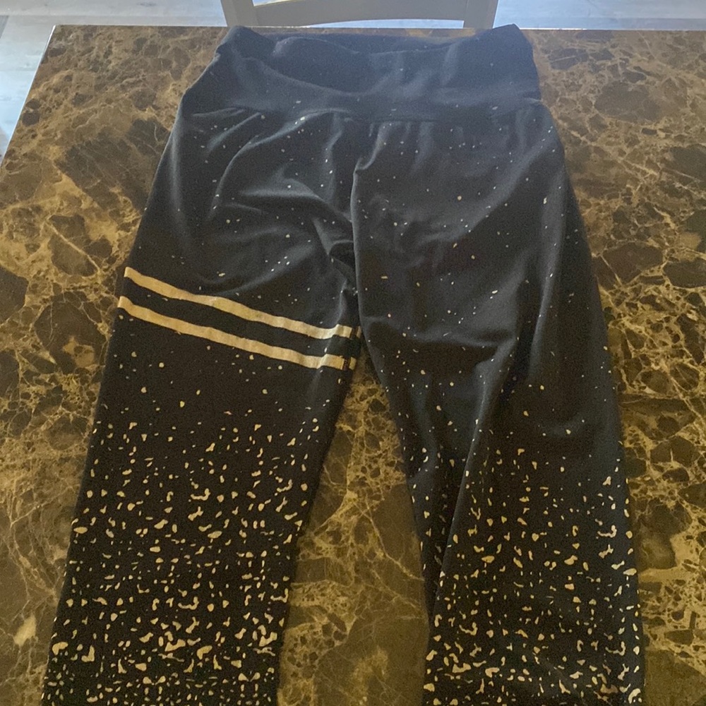 black and gold stripe and splattered effect leggings